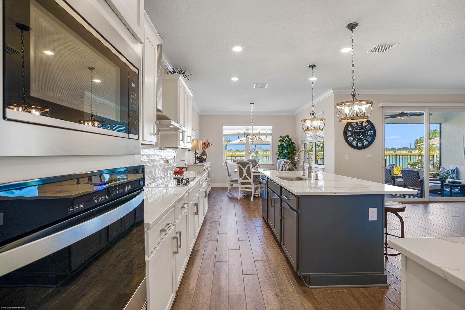 Kitchen run of white shaker cabinets with drawers below the counter, 5680 Hampton Park Circle